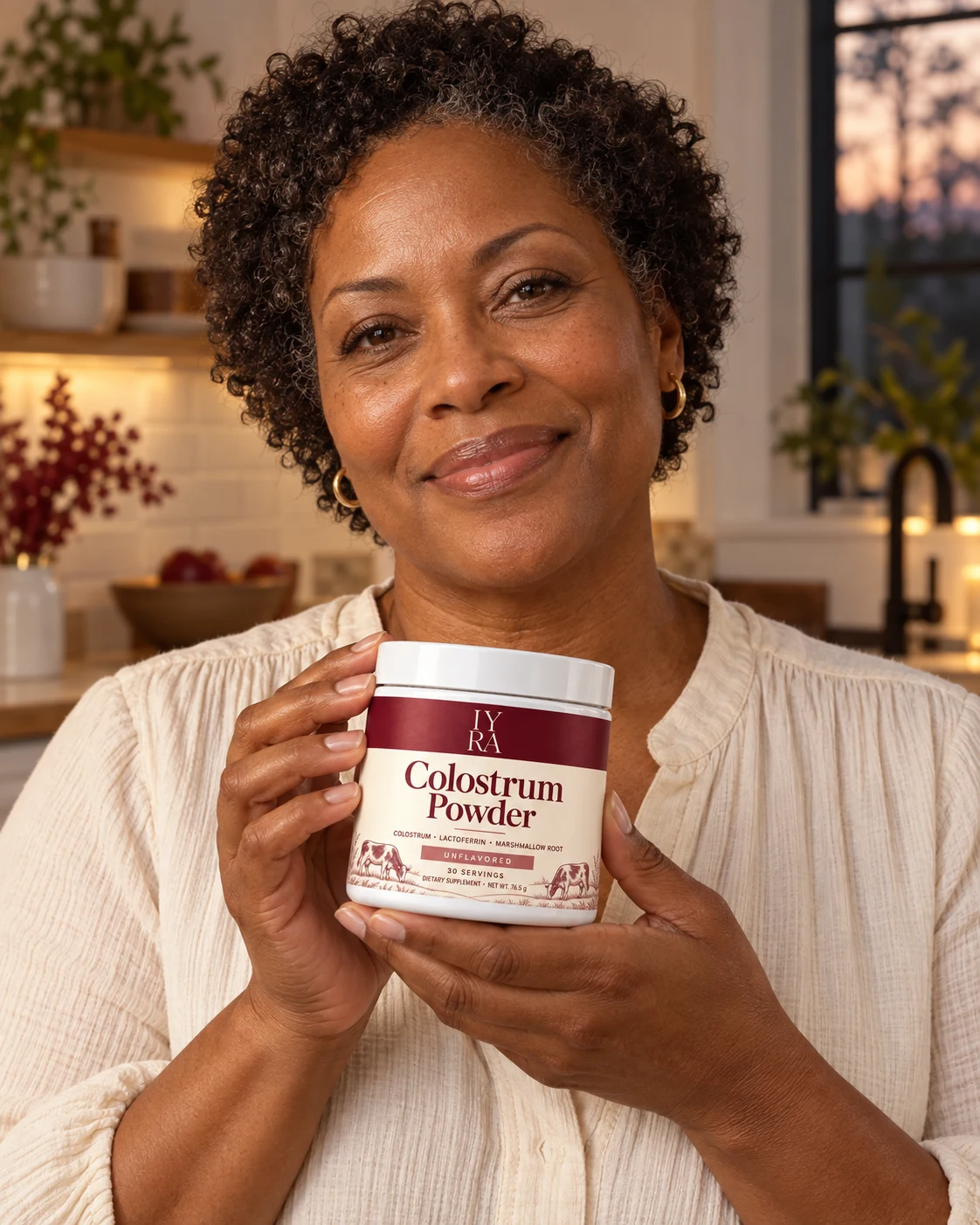 A woman with IYRA Colostrum Powder in her kitchen